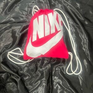 NIKE  hot pink and white drawstring bag, used​